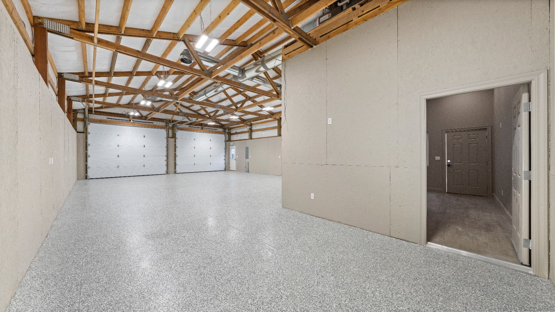 1116 E Clark St — Shop interior with doorway to finished space