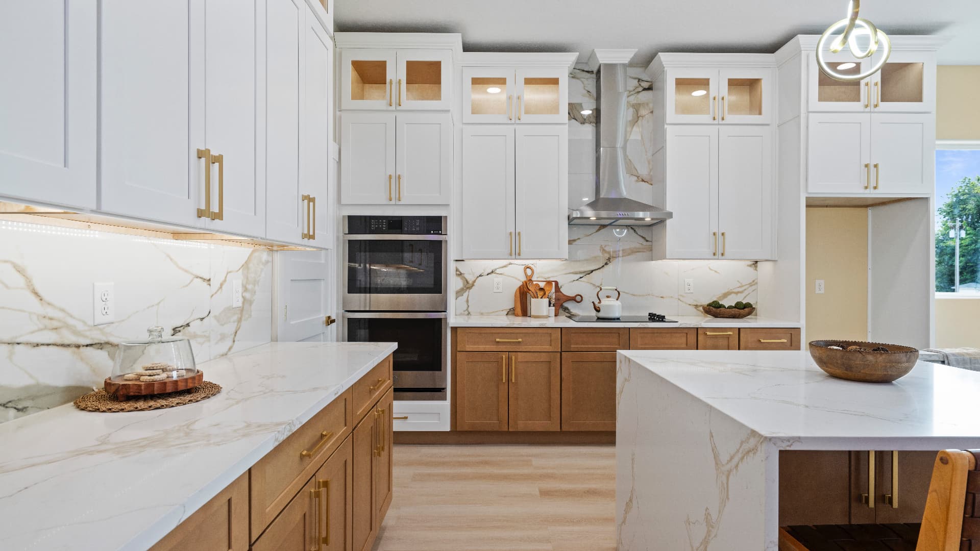 Kitchen cabinetry, range wall and double ovens at 1022 Rd 64