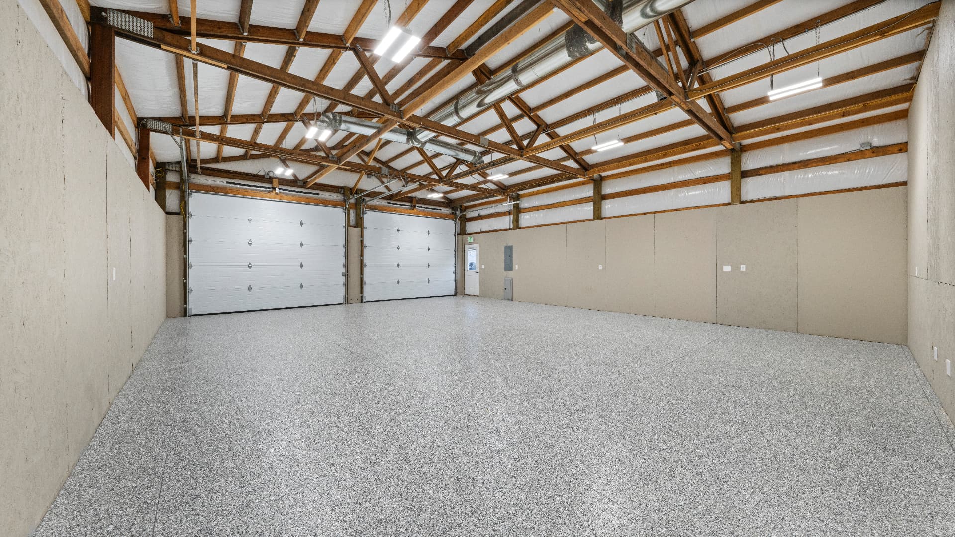 1116 E Clark St — Shop interior with overhead doors